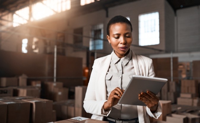 Shot of a factory manager using a digital tablet in a warehouse,